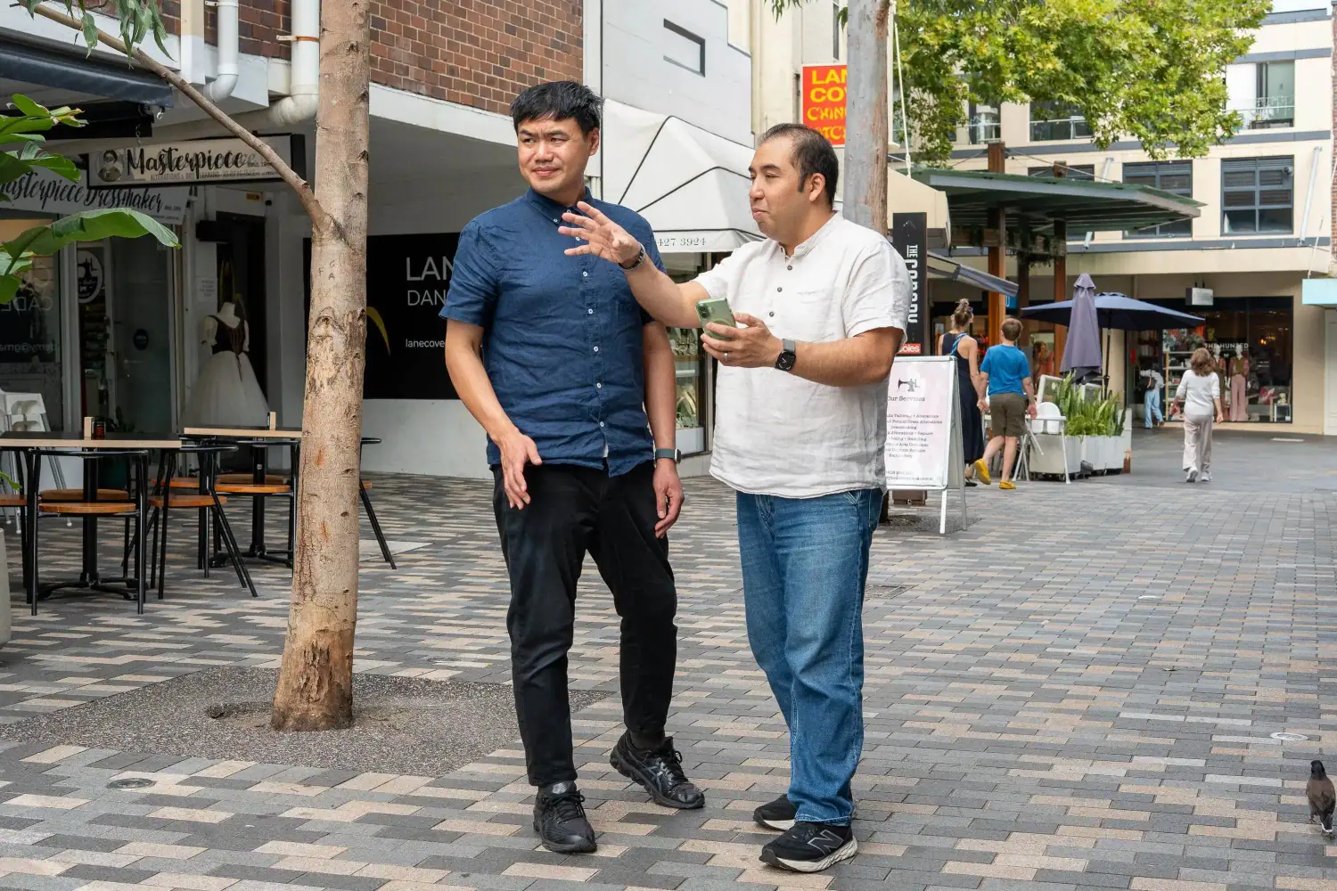 Seedwell Co. talking with a local business owner on a Chatswood street